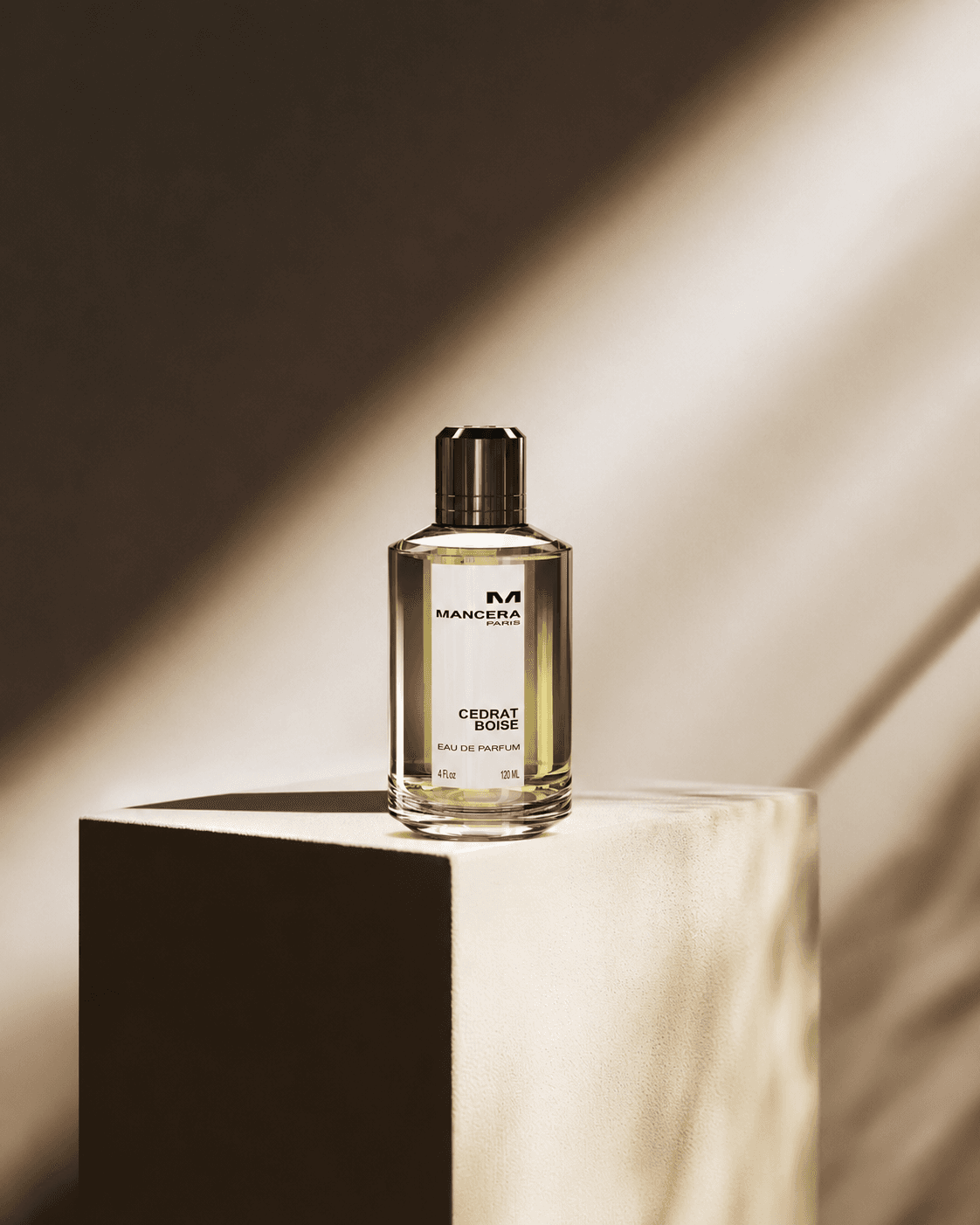 Perfume bottle displayed on a marble cube